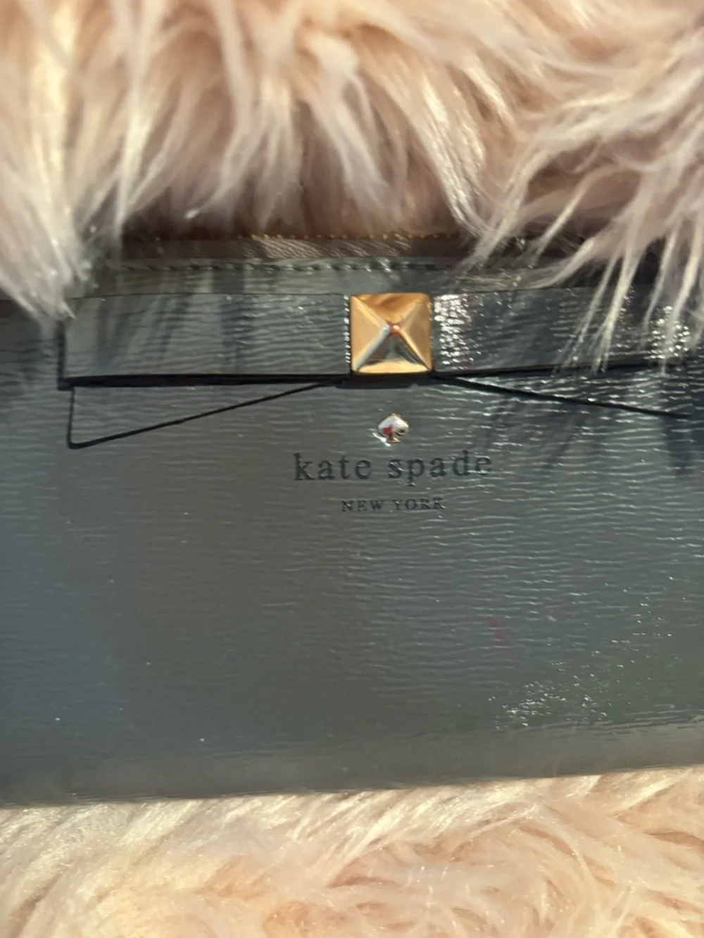 grey Kate Spade Beacon Court patent leather wallet